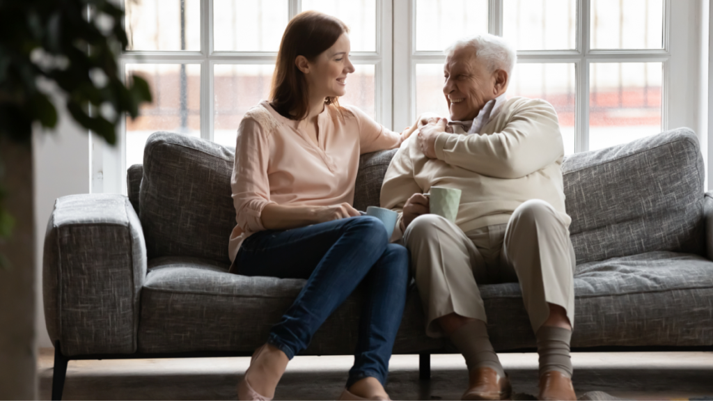 Father and daughter sitting on a sofa